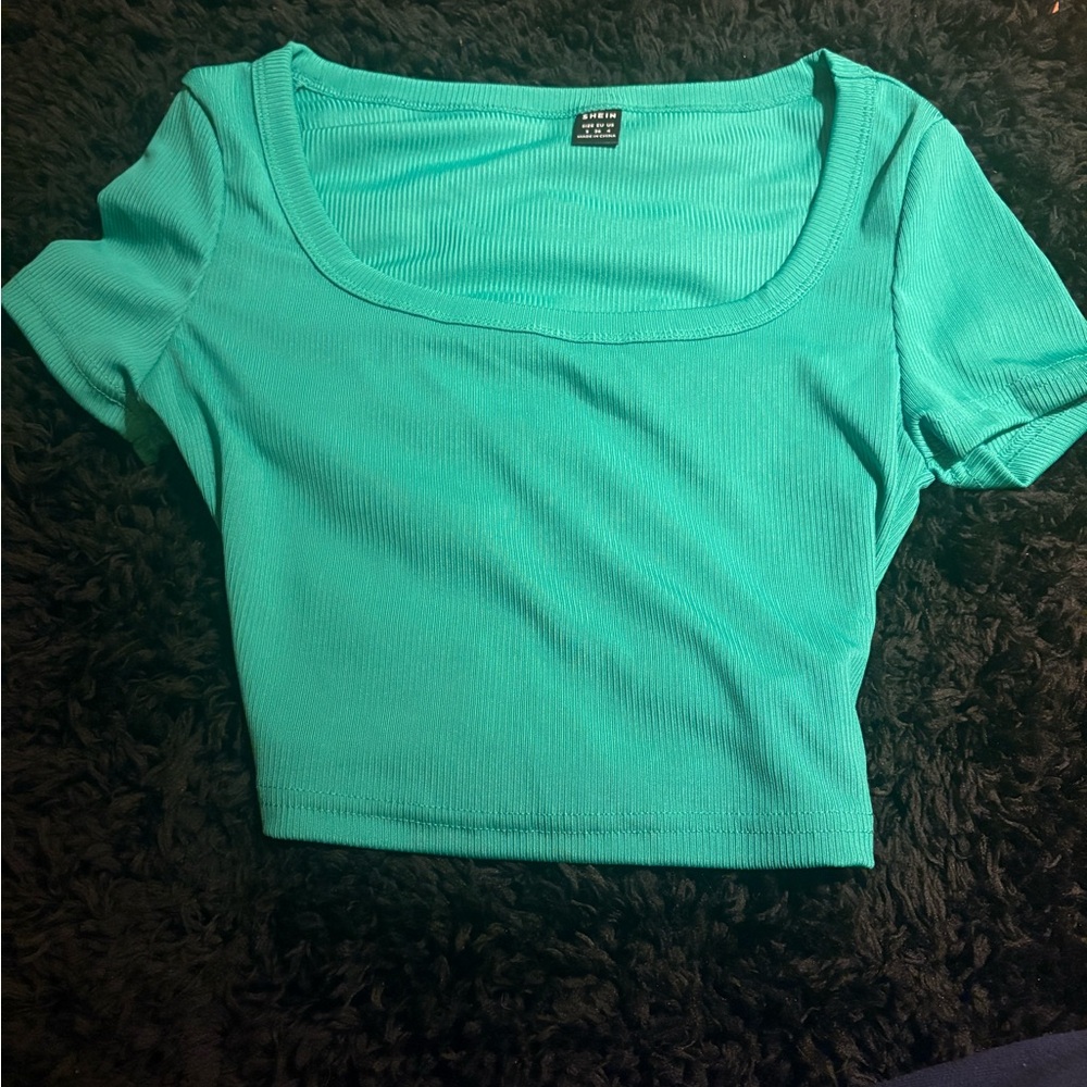 green cropped top